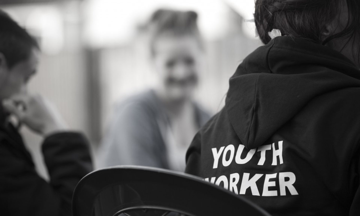 A picture of a youth worker working with young people