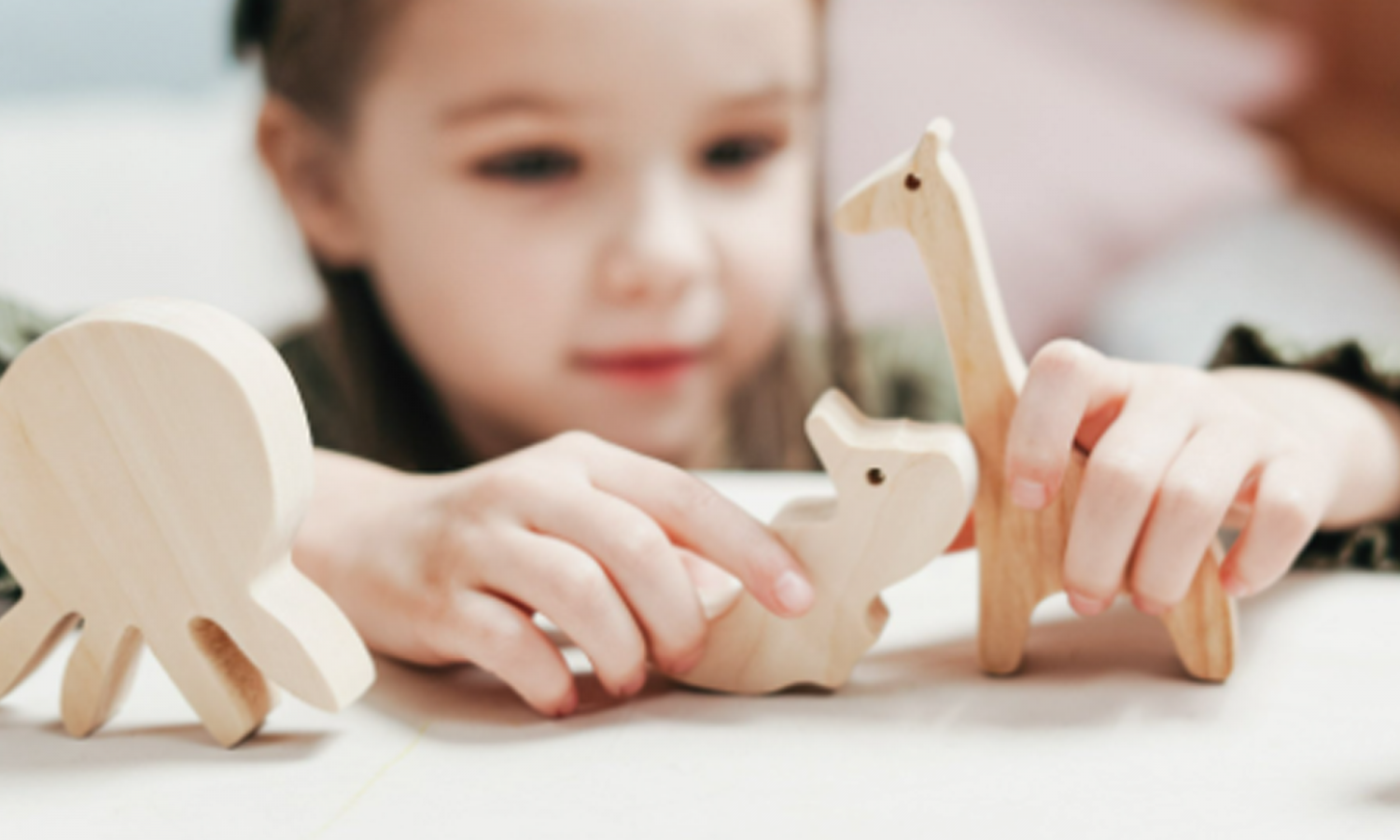 Little girl playing with toys