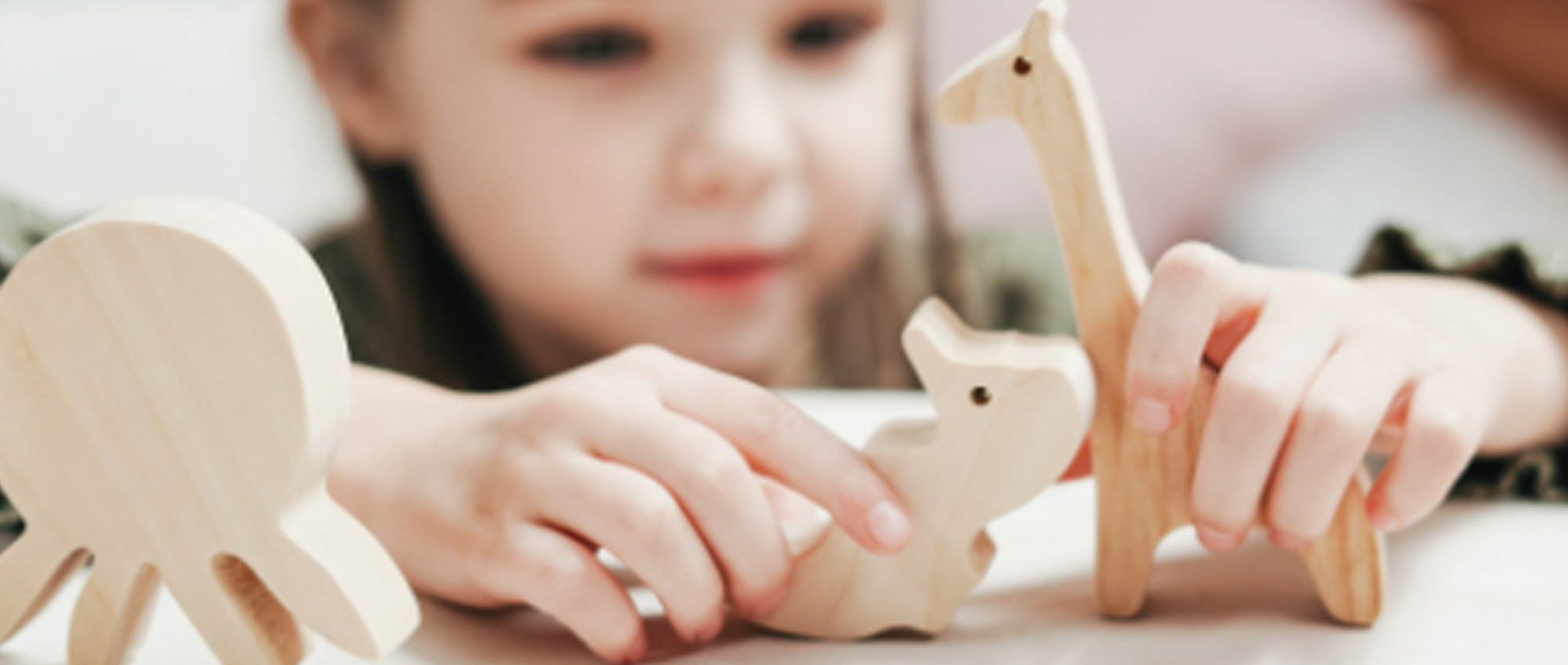 Little girl playing with toys