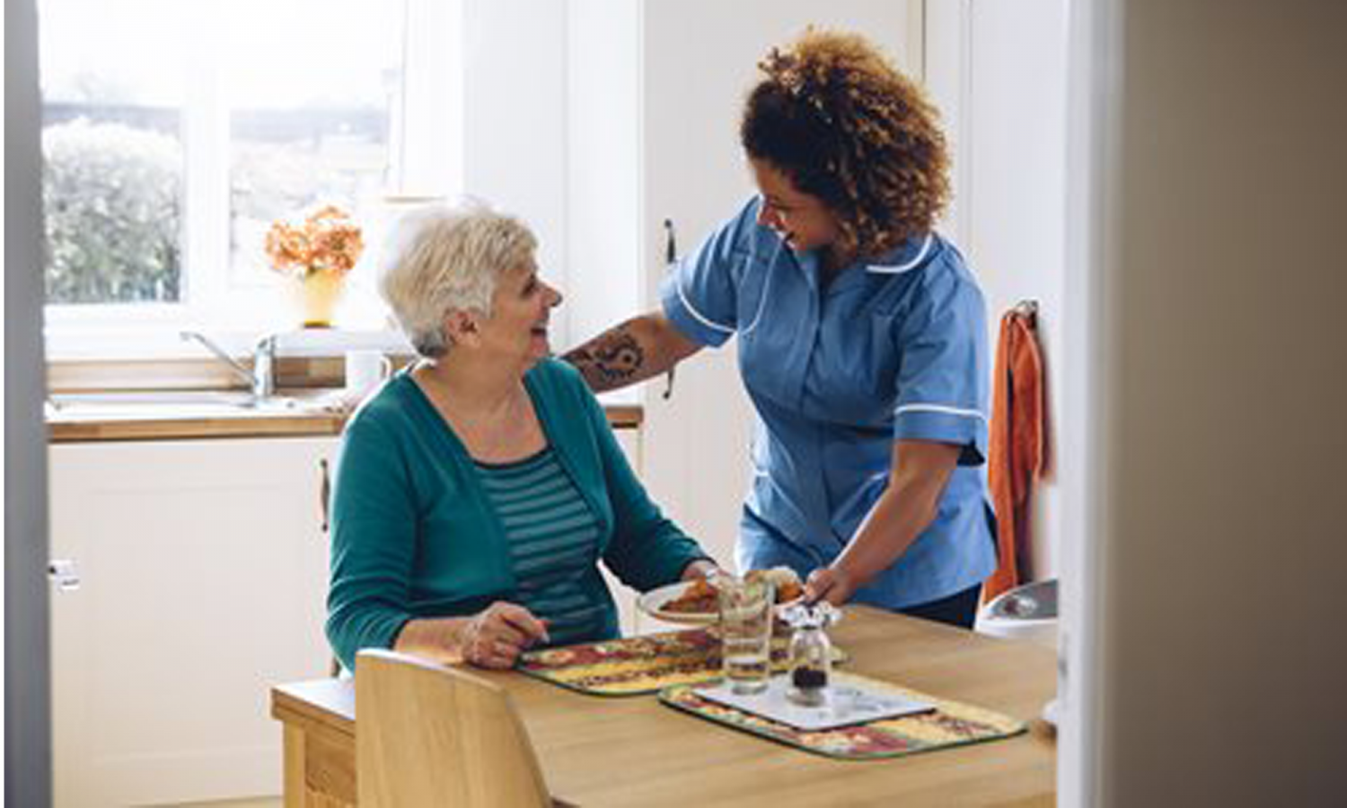 Care worker talking to a woman
