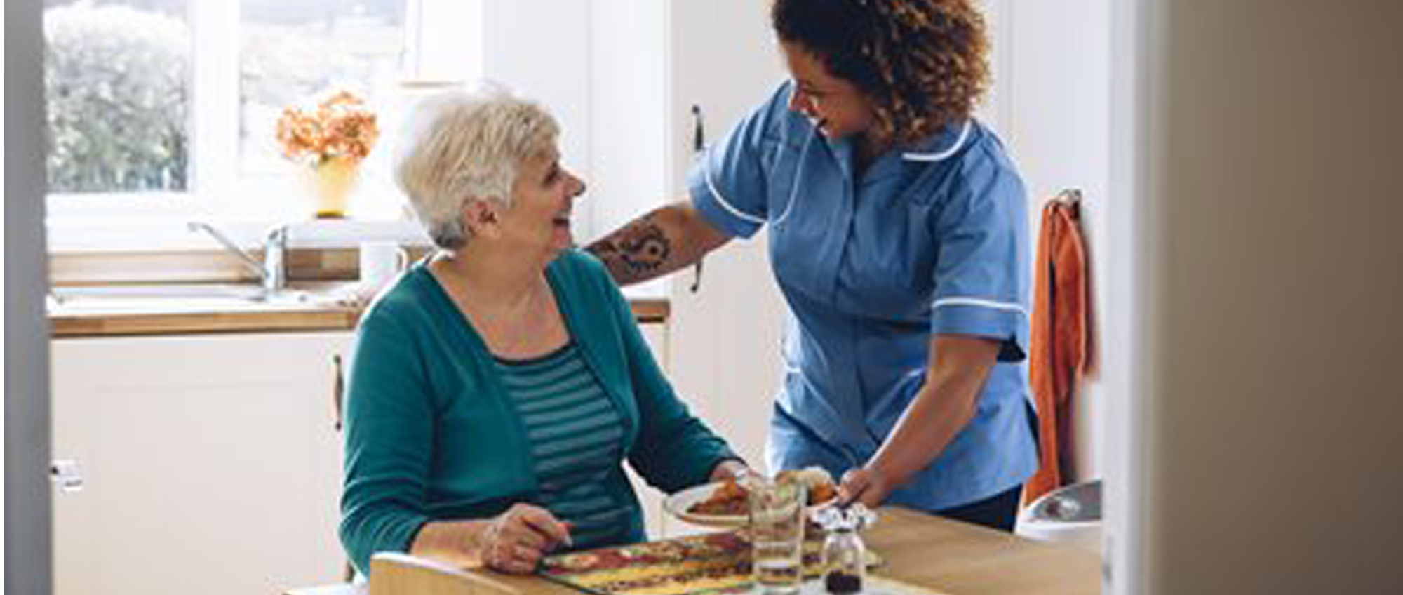 Care worker talking to a woman
