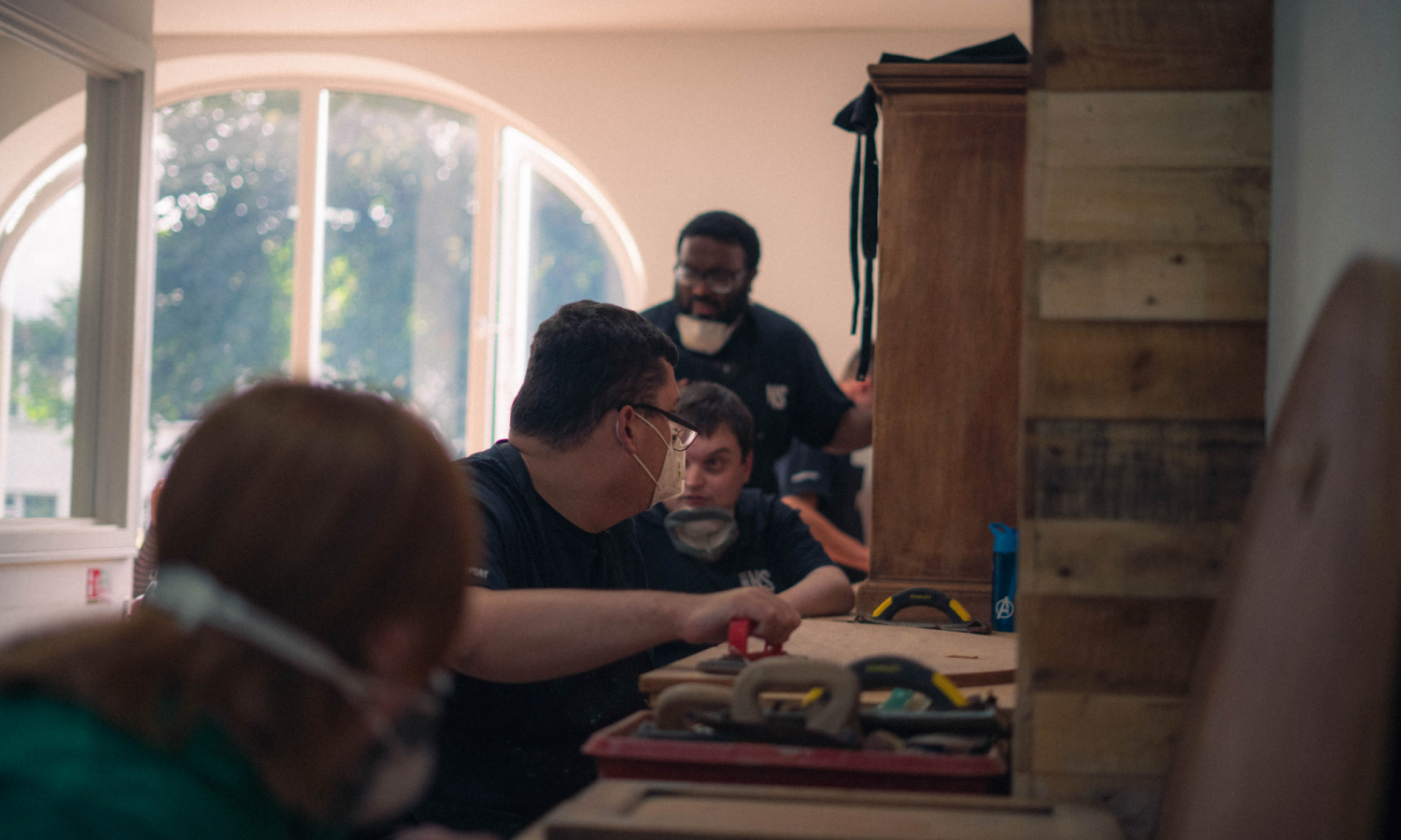 Photo of volunteers doing wood work