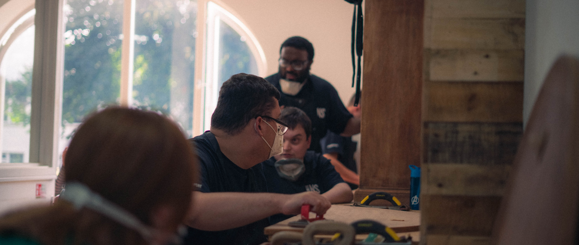 Photo of volunteers doing wood work