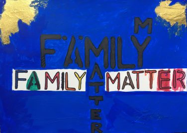 The words family matters hand painted
