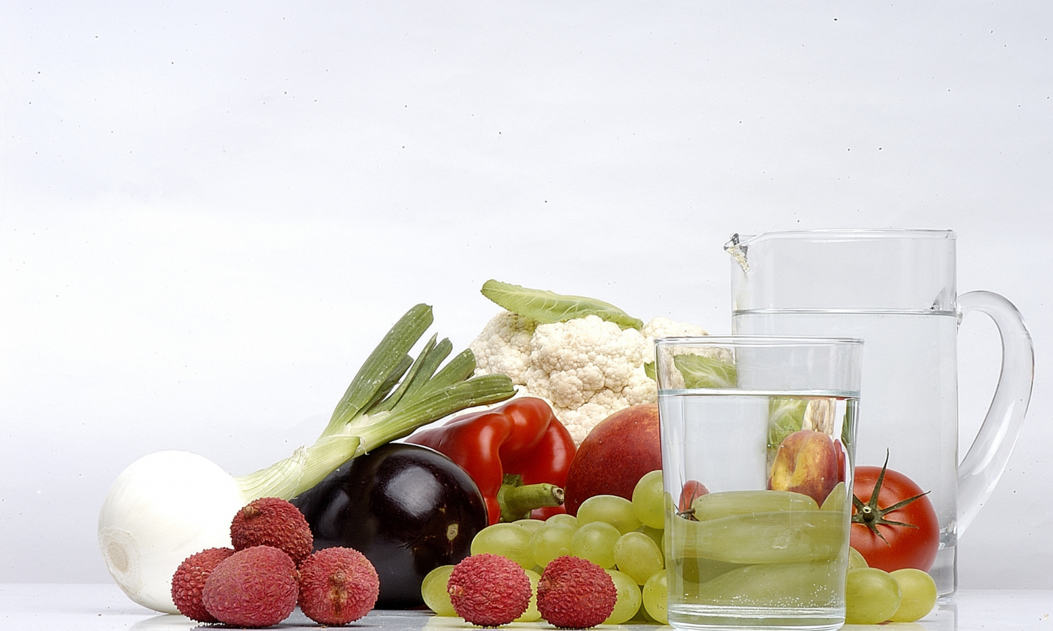 Photo of fruit and vegetables with a jug of water
