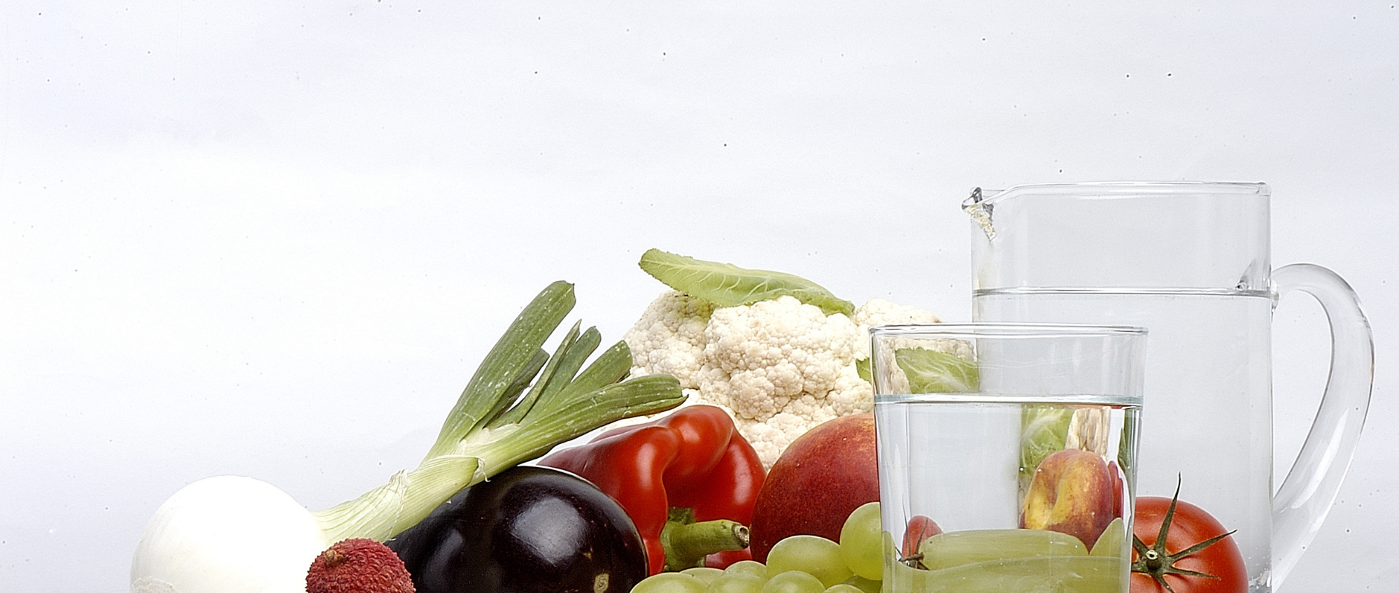 Photo of fruit and vegetables with a jug of water