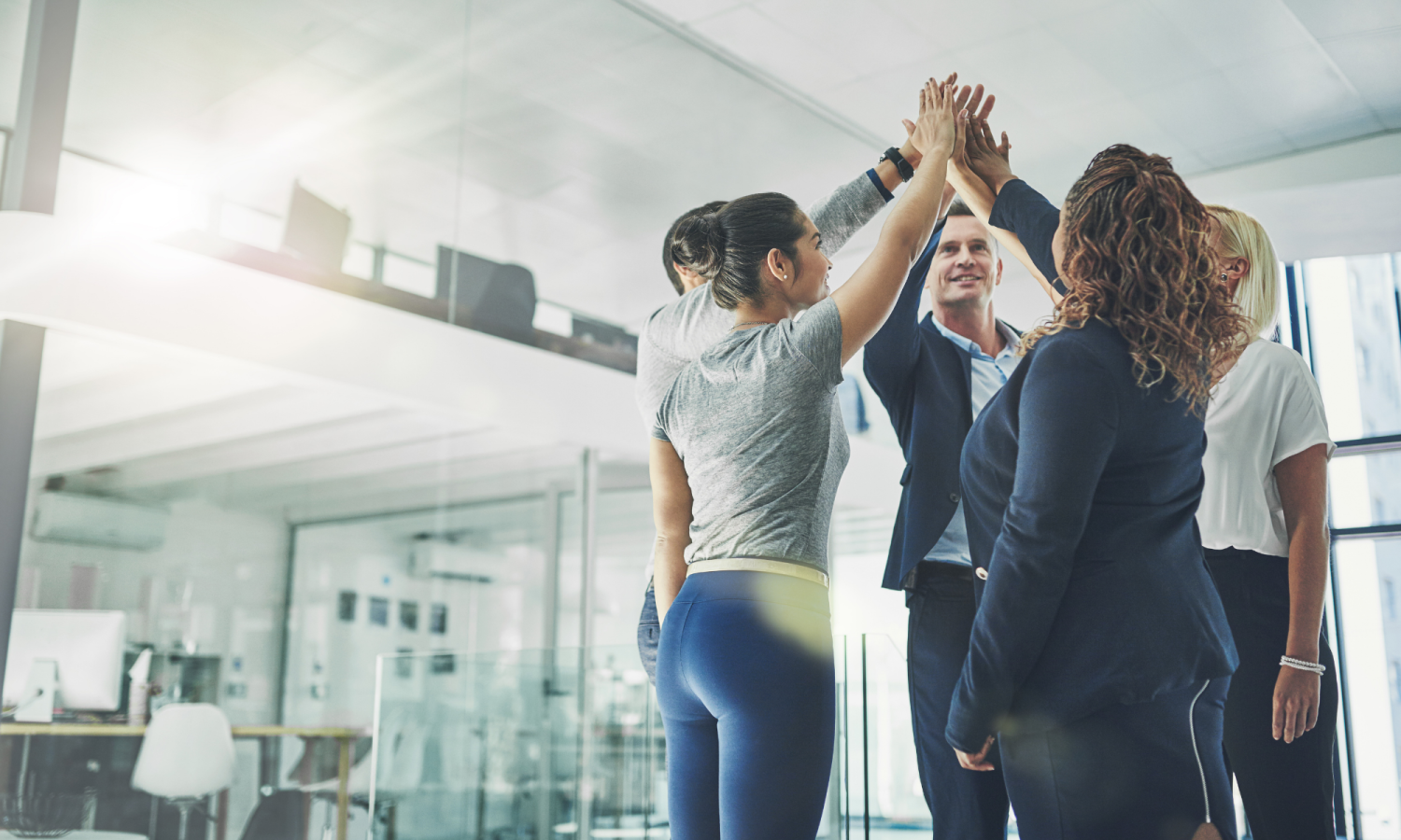 Photo of people highfiving